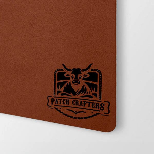 What is the recommended method for attaching leatherette patches to garments using a heat press?